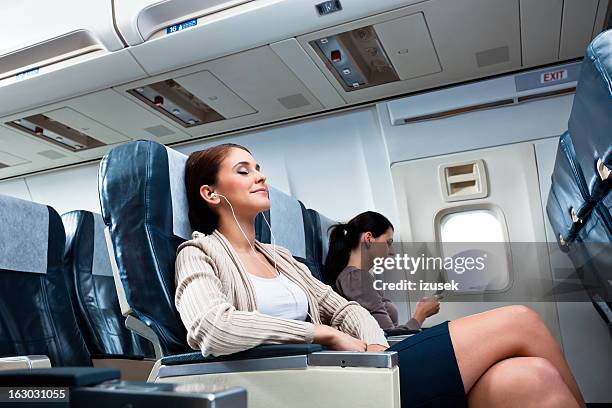 during the flight - vehicle seat stock pictures, royalty-free photos & images