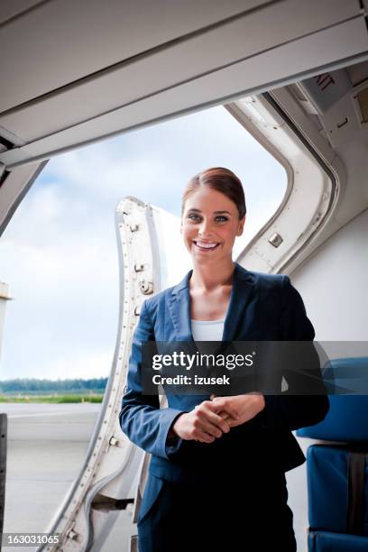 beautiful air stewardess - commercieel vliegtuig deur stockfoto's en -beelden