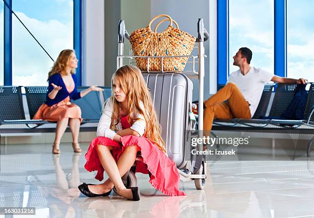 an argument at the airport - holiday sadness stock pictures, royalty-free photos & images