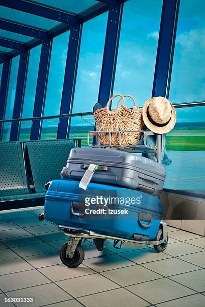 luggage trolley with suitcases - luggage trolley stockfoto's en -beelden