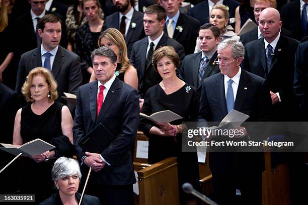 Anita Perry and Texas Gov. Rick Perry, and Laura and former president George W. Bush attend the funeral service for Van Cliburn at Broadway Baptist...