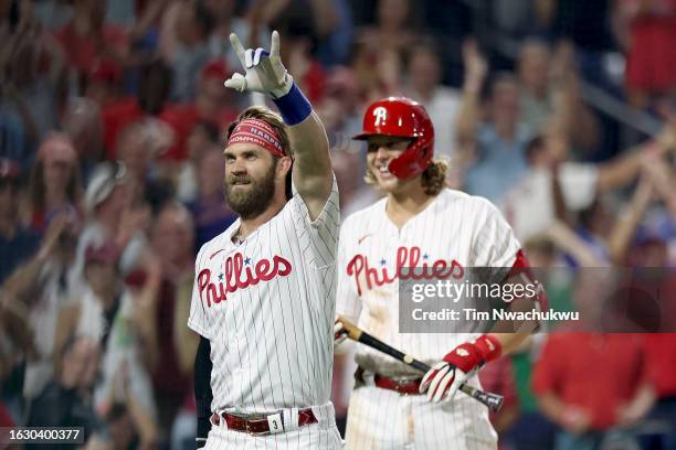 Bryce Harper of the Philadelphia Phillies reacts after hitting an inside the park home run during the fifth inning against the San Francisco Giants...