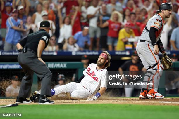 Bryce Harper of the Philadelphia Phillies scores an inside the park home run during the fifth inning against the San Francisco Giants at Citizens...