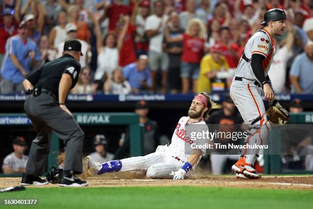 Bryce Harper of the Philadelphia Phillies scores an inside the park home run during the fifth inning against the San Francisco Giants at Citizens...