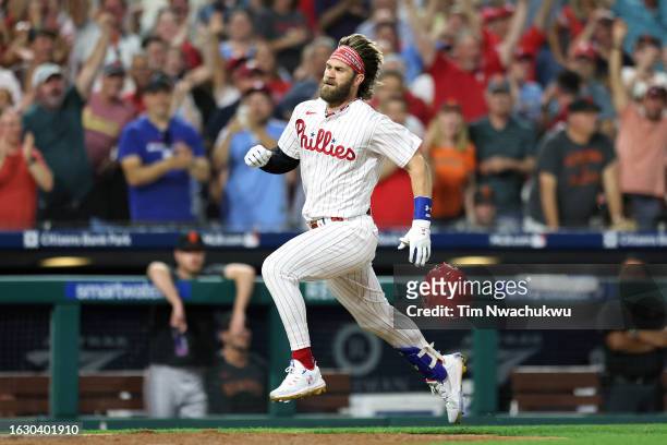 Bryce Harper of the Philadelphia Phillies rounds bases to score an inside the park home run during the fifth inning against the San Francisco Giants...