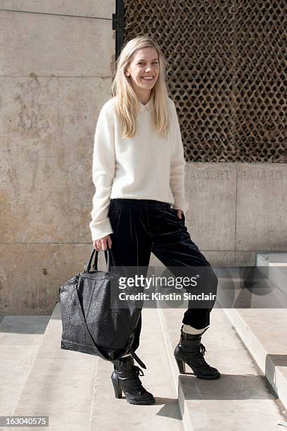 Fashion blogger Chantal Cocorosa wears an H and M trend sweater, vintage trousers, Alexander Wang bag and E-Bay boots on day 4 of Paris Womens...
