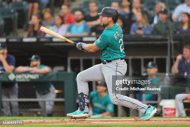 Cal Raleigh of the Seattle Mariners hits a two-run double against the Chicago White Sox during the first inning at Guaranteed Rate Field on August...