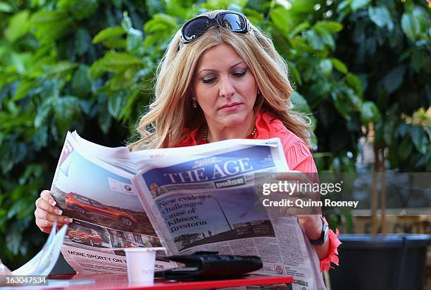 Connie Vretton reads The Age's first compact edition newspaper on March 4, 2013 in Melbourne, Australia. The Sydney Morning Herald and The Melbourne...