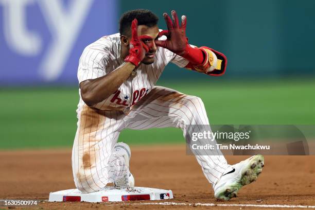 Johan Rojas of the Philadelphia Phillies reacts after hitting a 2-RBI triple during the seventh inning against the San Francisco Giants at Citizens...