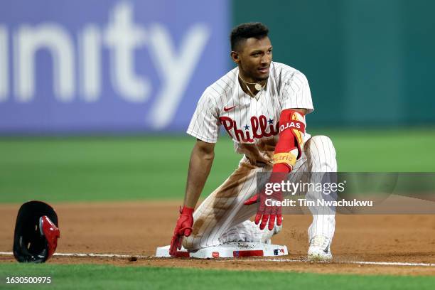 Johan Rojas of the Philadelphia Phillies reacts after hitting a 2-RBI triple during the seventh inning against the San Francisco Giants at Citizens...