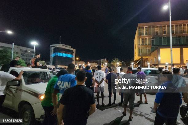 Demonstrators rally in front of the prime minister's offices in Tripoli early on August 29 to protest news of a meeting between Libya's foreign...