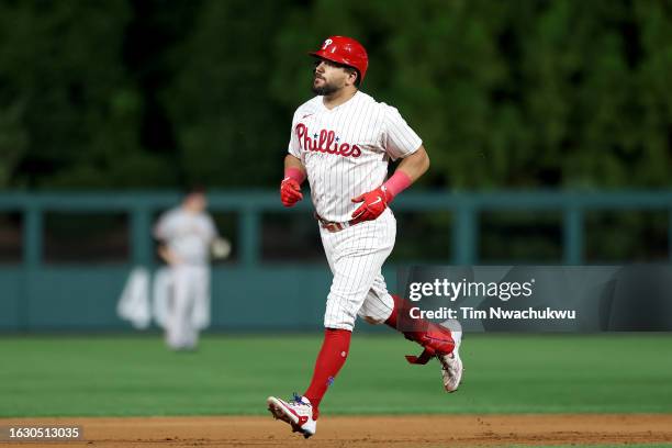 Kyle Schwarber of the Philadelphia Phillies rounds bases after hitting a two run home run during the seventh inning against the San Francisco Giants...