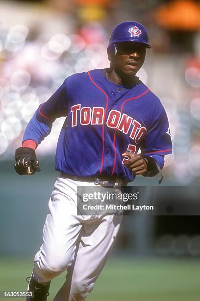 Orlando Hudson of the Toronto Blue Jays runs to third base during a baseball game against the Baltimore Orioles on August 23, 2002 at Camden Yards in...