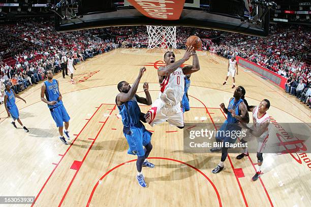 Thomas Robinson of the Houston Rockets goes to the basket against Bernard James of the Dallas Mavericks on March 3, 2013 at the Toyota Center in...