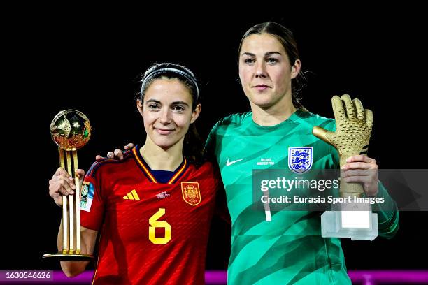 Aitana Bonmati of Spain poses for photos with the golden ball after winning England Goalkeeper Mary Earps who poses with the golden glove during the...