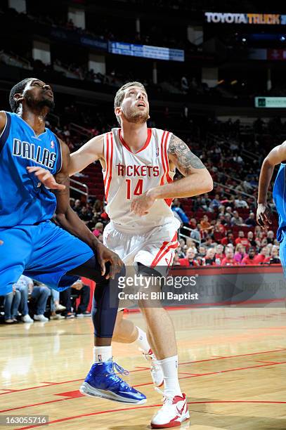 Tim Ohlbrecht of the Houston Rockets battles for positioning against Bernard James of the Dallas Mavericks on March 3, 2013 at the Toyota Center in...