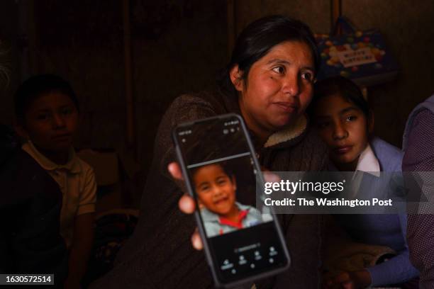 Daniela Villanueva Leon holds up a photo of her son Axel Villanueva who died from Rocky Mountain Fever, a bacterial disease, in Ejido Padre Kino,...