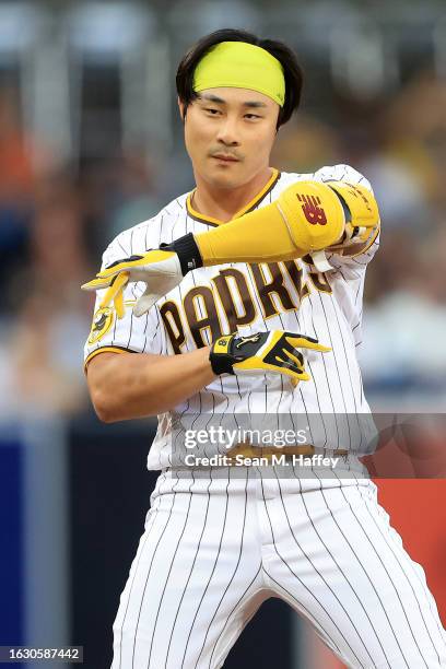 Ha-Seong Kim of the San Diego Padres reacts after hitting a double during the first inning of a game against the Miami Marlins at PETCO Park on...