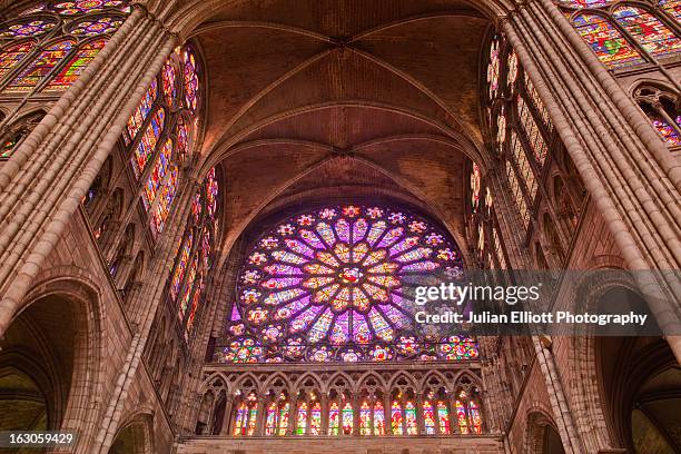 the rose window in saint denis basilica. - rose window stock pictures, royalty-free photos & images