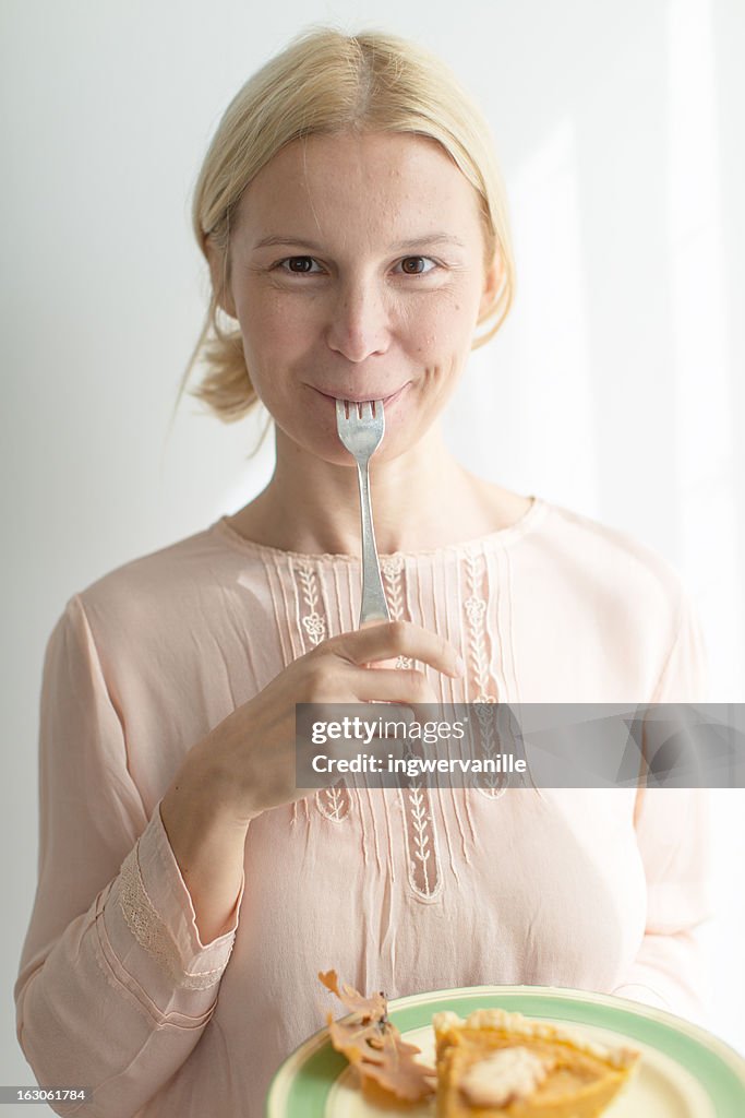 Woman with spoon and tarte