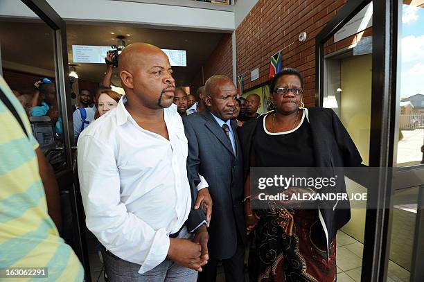 Joseph father of Mido Macia, and other family members leave the Benoni Magistrate's Court on March 4, 2013. Mido Macia, the 27-year-old taxi driver...