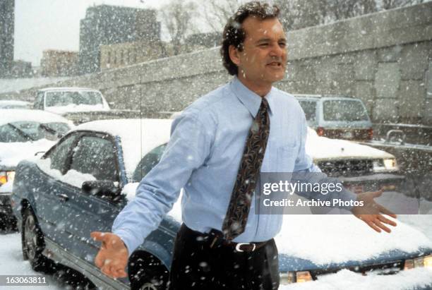 Bill Murray runs through the snow in a scene from the film 'Groundhog Day', 1993.