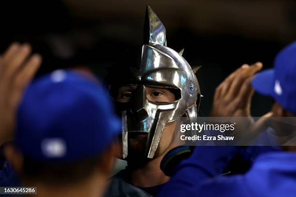 Bobby Witt Jr. #7 of the Kansas City Royals is congratulated by teammates after he hit a home run against the Oakland Athletics in the sixth inning...