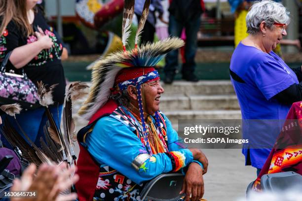 First Nation Elder wearing full dress watches as attendees participate in the round dance. As Pride weekend kicks off in Edmonton, the Indigenous...