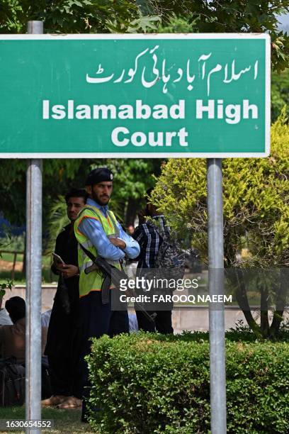Security personnel stands guard outside the Islamabad High Court in Islamabad on August 29, 2023.