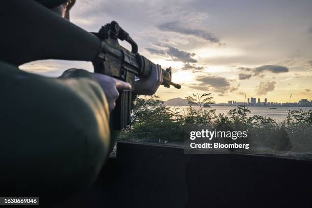 Statue of a soldier with its gun pointed towards Xiamen on the Chinese mainland across the Taiwan Strait on Lieyu Island in Kinmen, Taiwan, on...