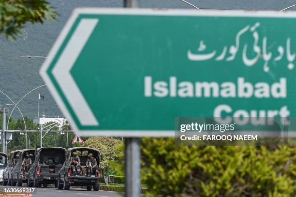 Convoy of Pakistani army passes the Islamabad High Court building in Islamabad on August 29, 2023.