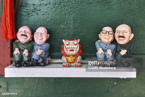 Figurines of Taiwan's late dictator Chiang Kai-shek, from left, and former Chinese leader Mao Zedong, a Kinmen Wind Lion God, Taiwan's former...