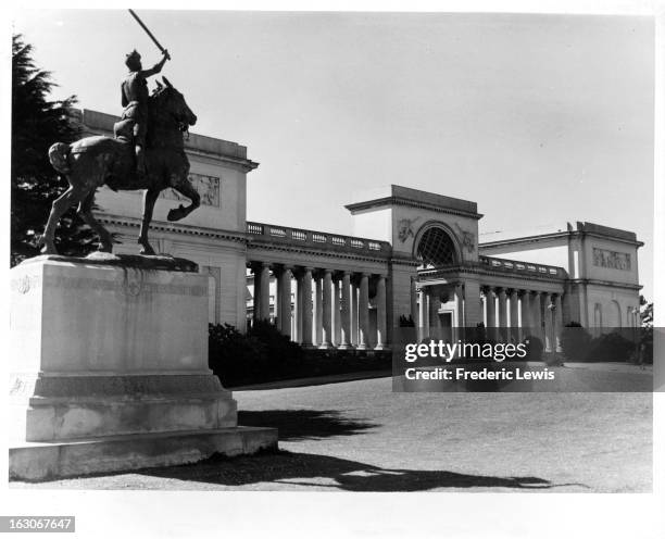 An entrance view to the Palace of the Legion Of Honor with a statue to the left, of a man on a horse holding a sword in the air at Lincoln Park in...