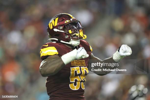 Henry of the Washington Commanders celebrates after making a tackle against the Baltimore Ravens during an NFL preseason game at FedExField on August...