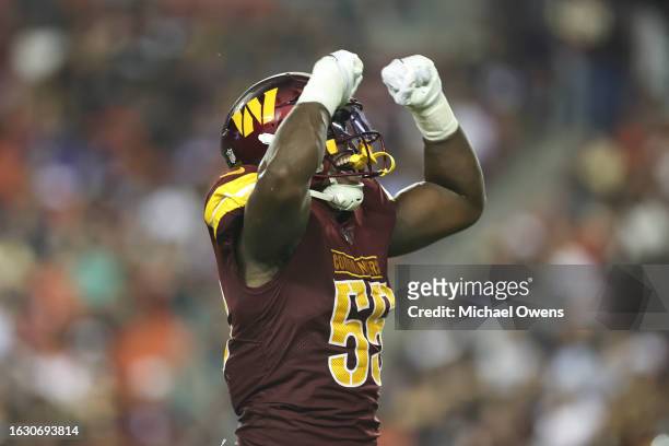 Henry of the Washington Commanders celebrates after making a tackle against the Baltimore Ravens during an NFL preseason game at FedExField on August...