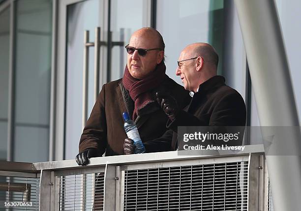 Avram Glazer and Joel Glazer the Co-Chairmen of Manchester United look on during a training session at Carrington Training Ground on March 4, 2013 in...