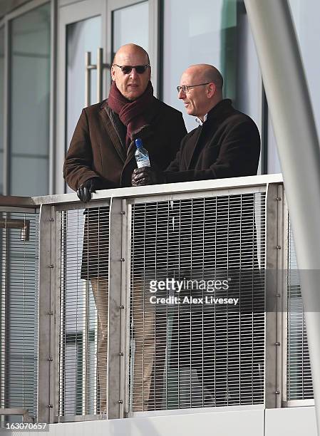 Avram Glazer and Joel Glazer the Co-Chairmen of Manchester United look on during a training session at Carrington Training Ground on March 4, 2013 in...