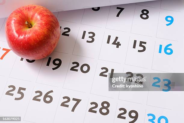 red apple on calendar - freshers week stock pictures, royalty-free photos & images