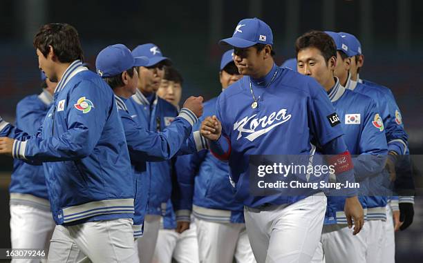 Lee Dae-Ho of South Korea celebrates with his team mates after wnning against Australia during the World Baseball Classic First Round Group B match...