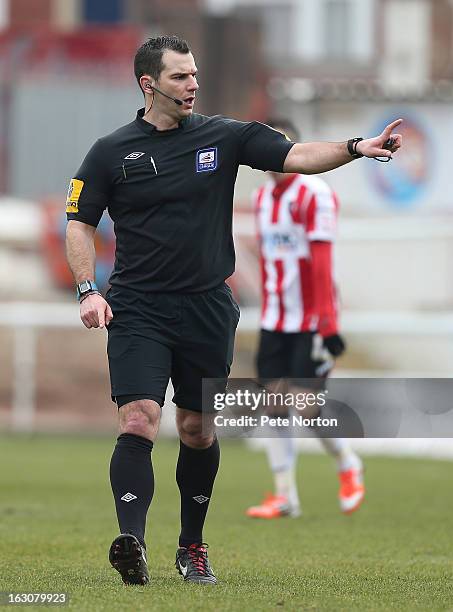 Referee Tim Robinson in action during the npower League Two match between Exeter City and Northampton Town at St James's Park on March 2, 2013 in...