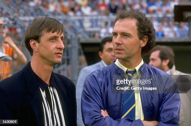 Franz Beckenbauer of West Germany stands with Johan Cruyff of Holland during the European Championship qualifying match between Holland and Hungary...