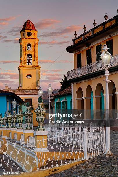 bell tower at plaza mayor at sunrise - trinidad stock-fotos und bilder