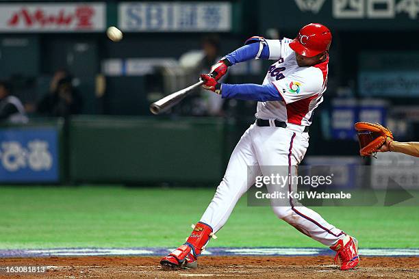 Outfielder Frederich Cepeda of Cuba hits a double in the bottom half of the fourth inning during the World Baseball Classic First Round Group A game...