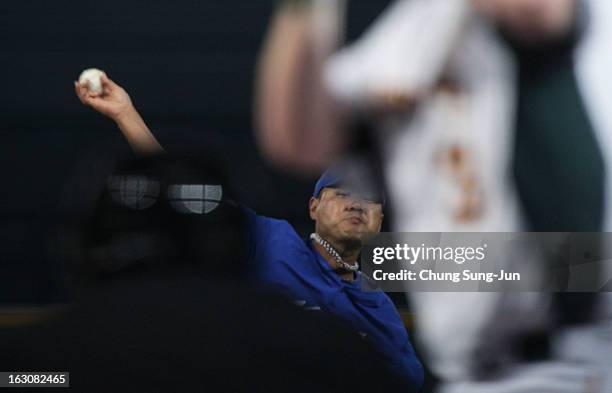 Song Seung-Jun of South Korea pitches in the second inning during the World Baseball Classic First Round Group B match between South Korea and...