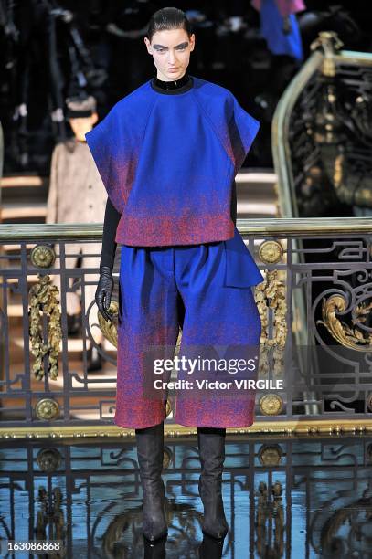 Model walks the runway during the John Galliano Fall/Winter 2013 Ready-to-Wear show as part of Paris Fashion Week at Le Centorial on March 3, 2013 in...