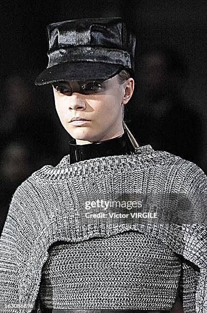 Cara Delevingne walks the runway during the John Galliano Fall/Winter 2013 Ready-to-Wear show as part of Paris Fashion Week at Le Centorial on March...