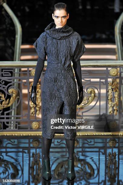 Model walks the runway during the John Galliano Fall/Winter 2013 Ready-to-Wear show as part of Paris Fashion Week at Le Centorial on March 3, 2013 in...