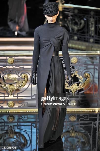 Model walks the runway during the John Galliano Fall/Winter 2013 Ready-to-Wear show as part of Paris Fashion Week at Le Centorial on March 3, 2013 in...