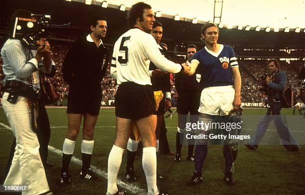 West Germany Captain Franz Beckenbauer shakes hands with the East Germany Captain before a match. \ Mandatory Credit: Allsport UK /Allsport