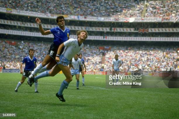 Jose-Luis Brown of Argentina tangles with Terry Butcher of England during the World Cup quarter-final at the Azteca Stadium in Mexico City. Argentina...